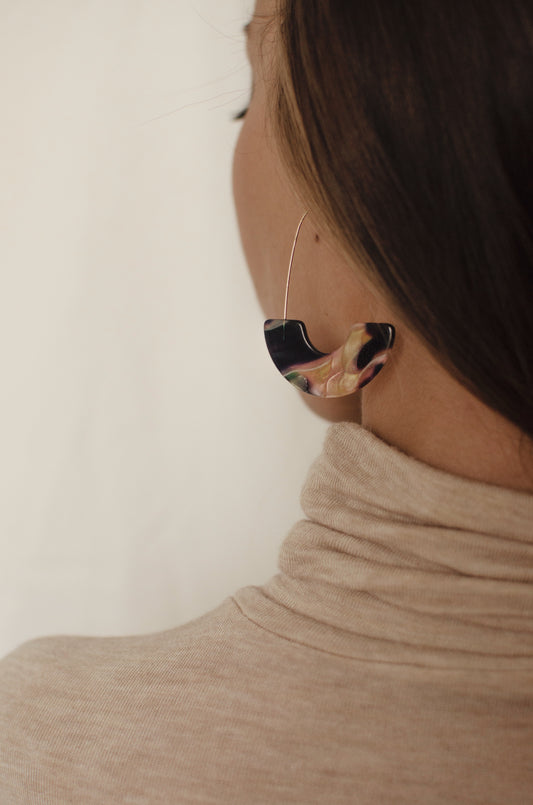 girl with acrylic hoop earrings turtleneck janna Conner