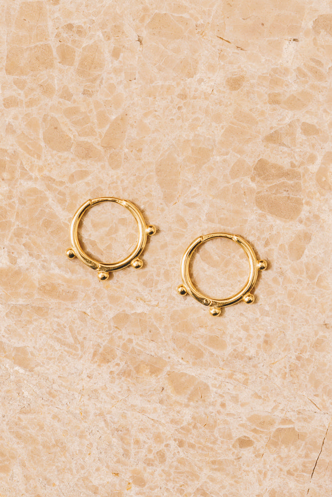 gold huggie hoop earrings with gold ball detailing