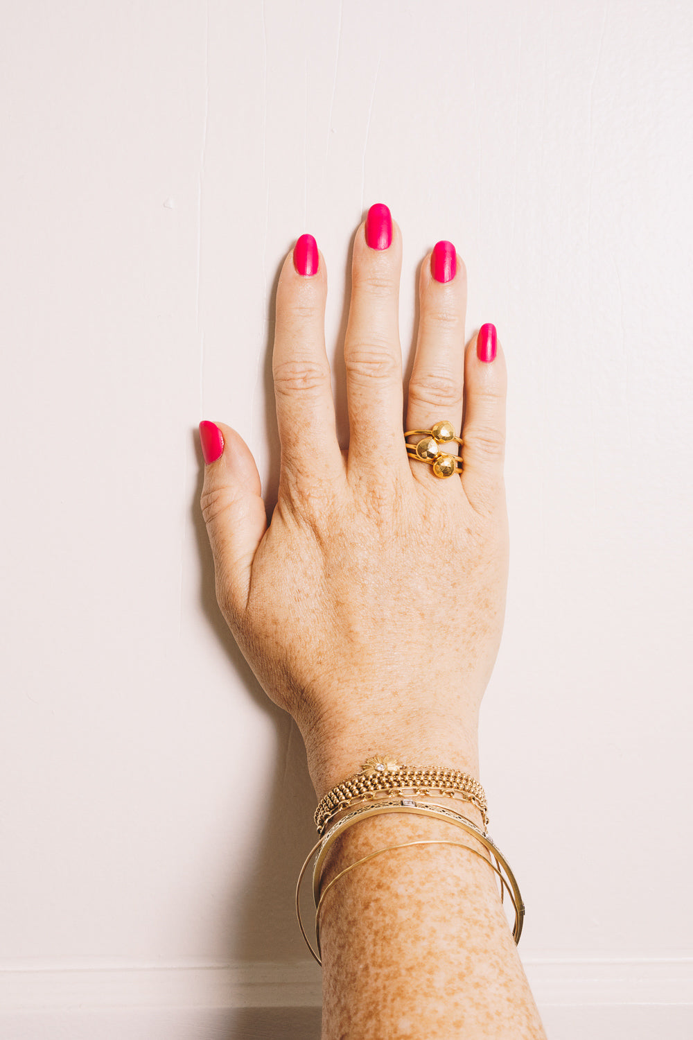 gold pyrite faceted teardrop stacking rings on hand