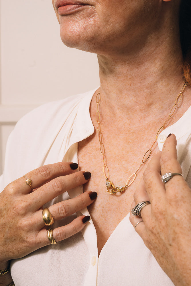 gold paperclip chain necklace on model with diamanté clasps