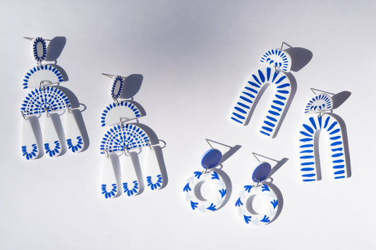 blue and white statement earrings