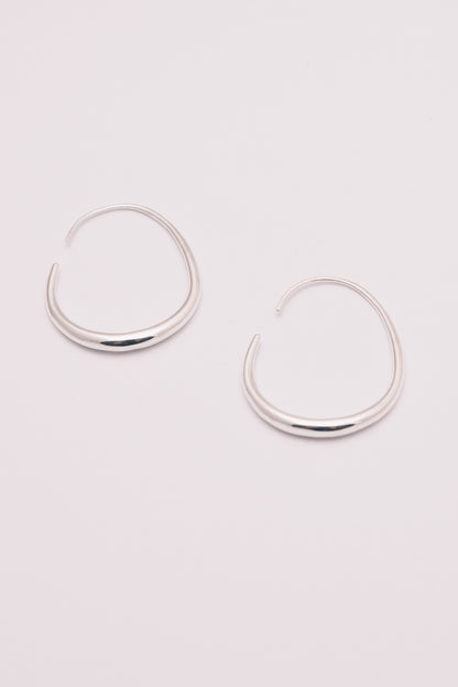 silver threader hoop earrings on white background view from below
