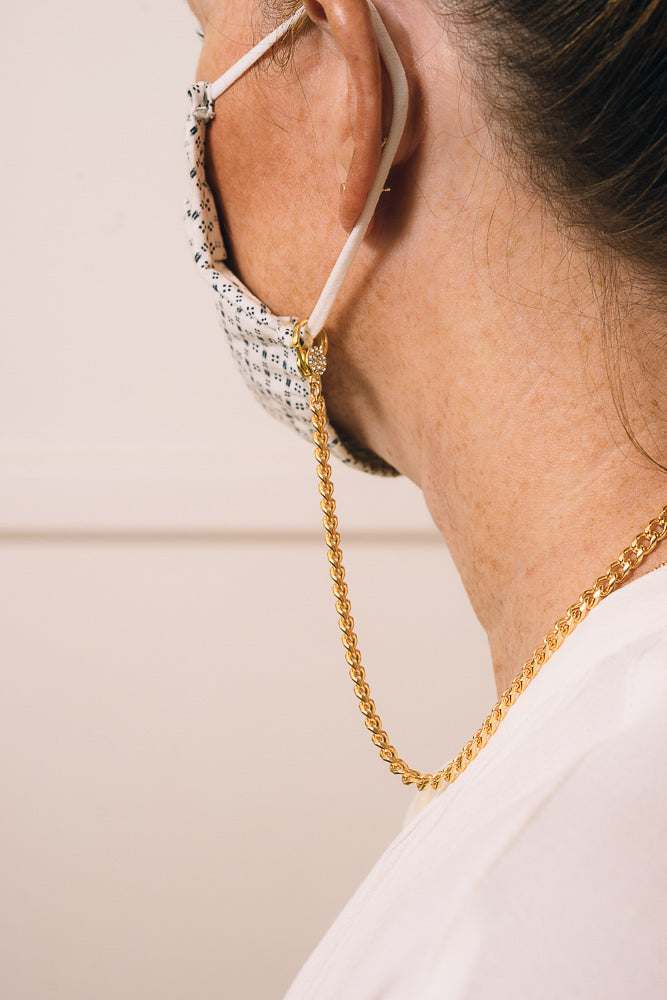 mask chain necklace closeup
