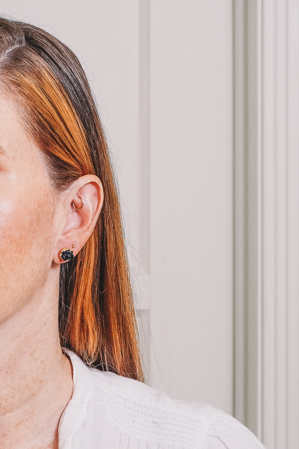 onyx rosette stud earrings on model
