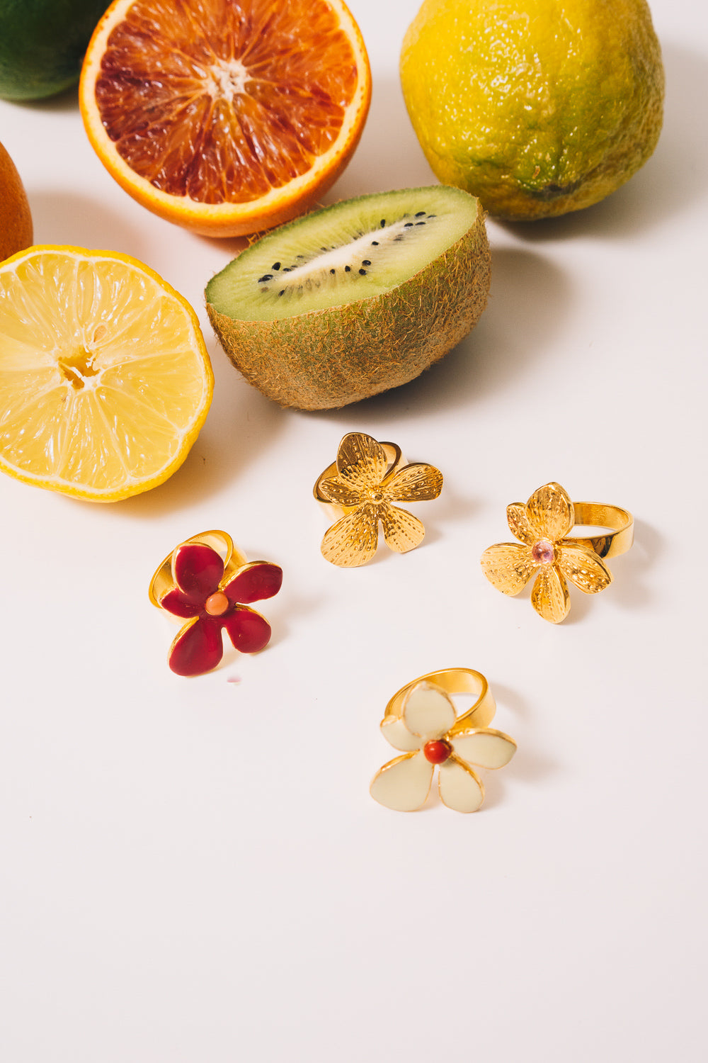 gold and enamel flower rings