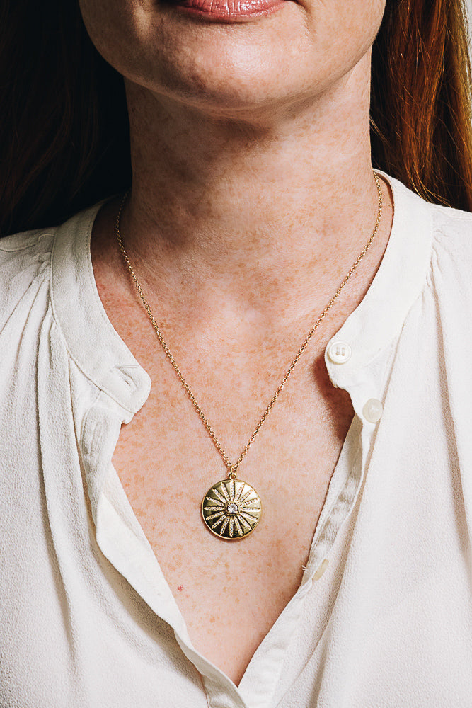 gold medallion pendant necklace on model