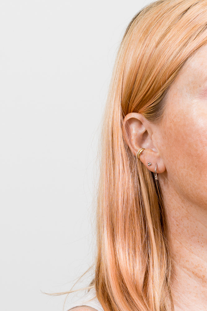 silver hoop and double piercing and ear cuffs on model