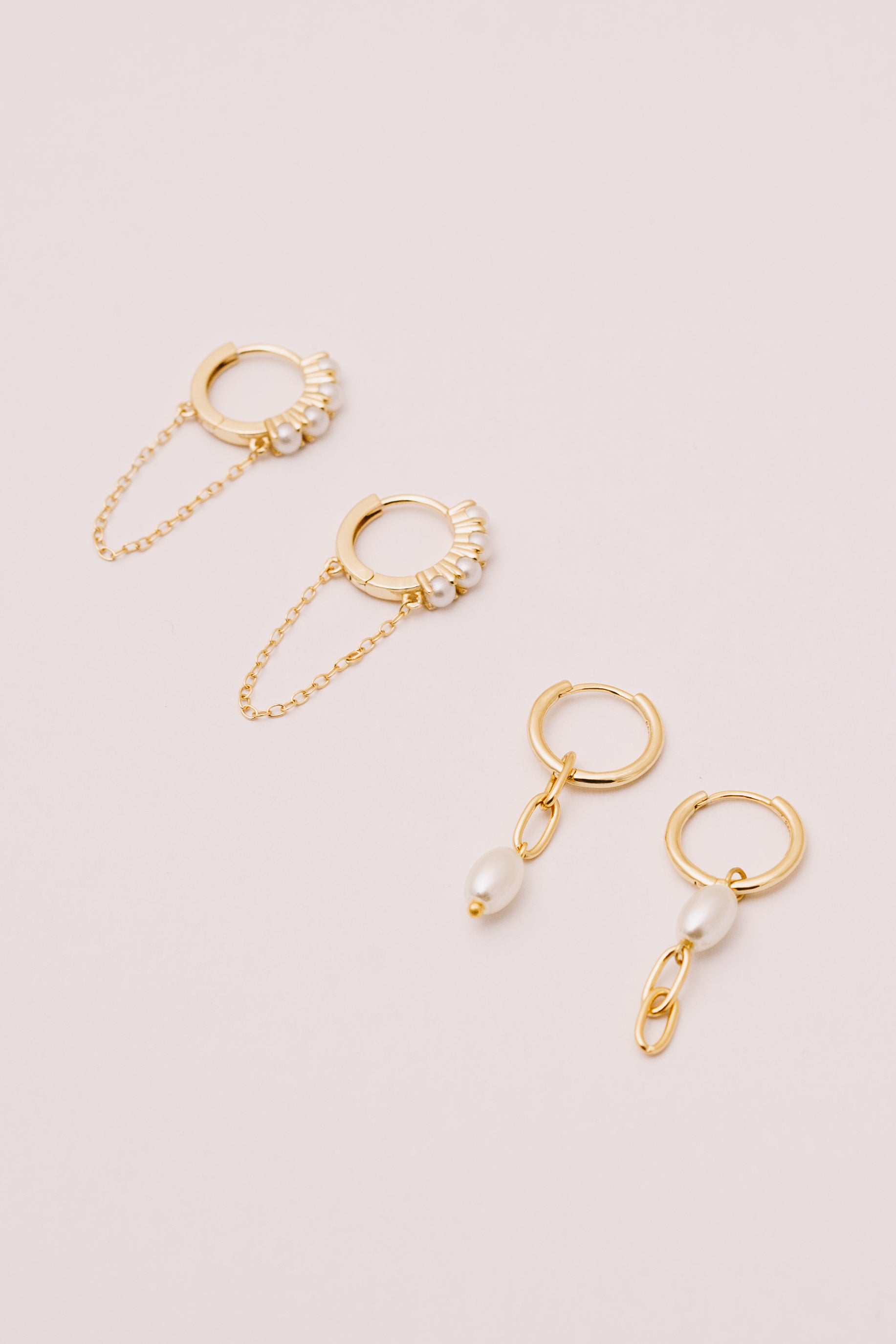 pearl huggie hoop earrings with chain dangles and asymmetrical pearl dangle hoops