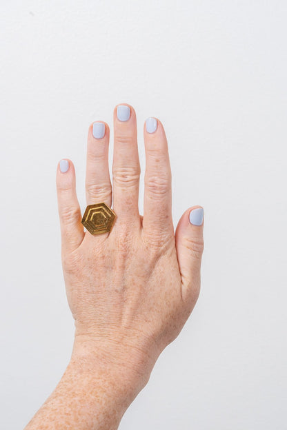 Art Deco gold hexagon ring on hand