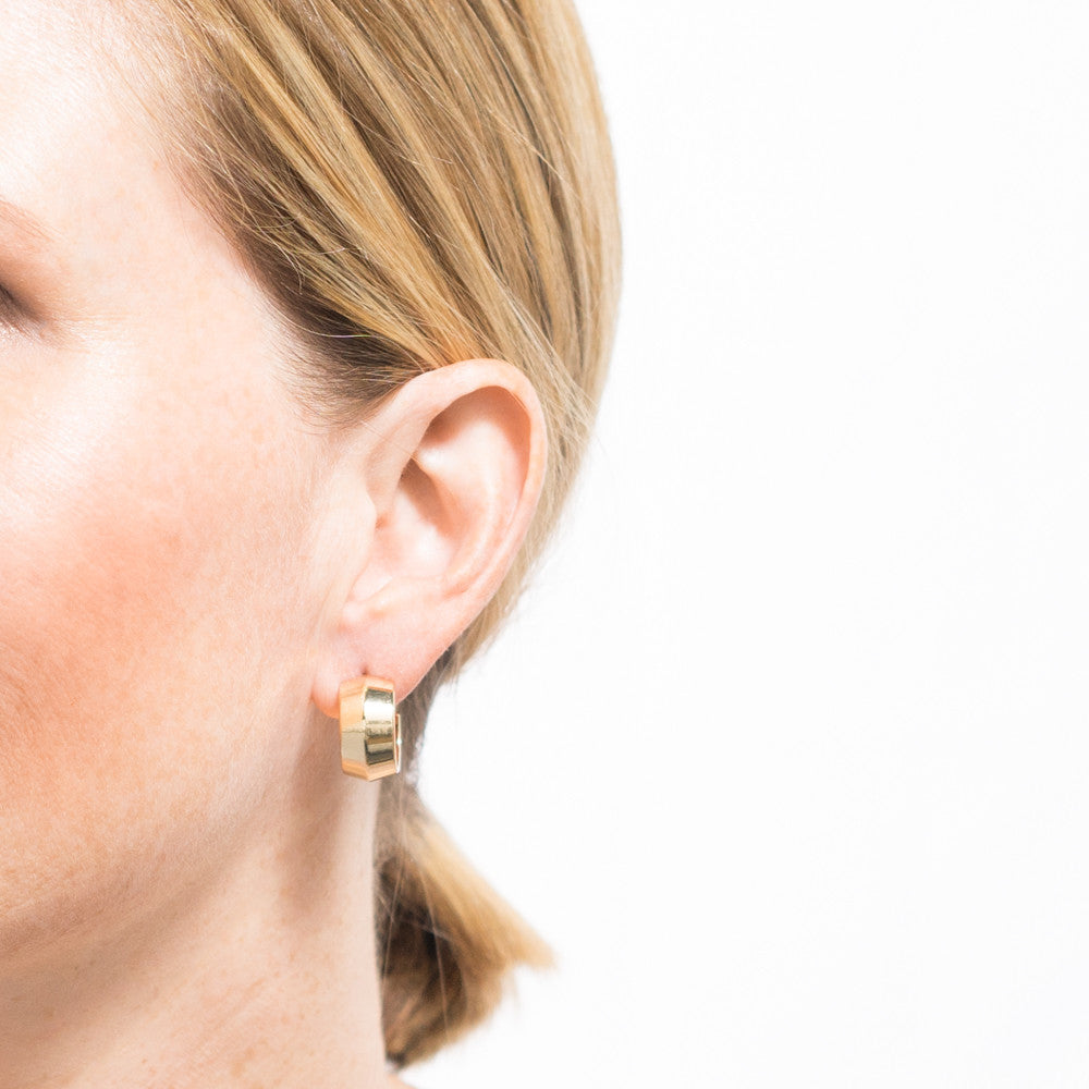 gold hoop earrings on model