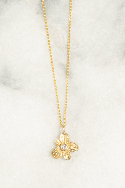 gold flower charm necklace white sapphire