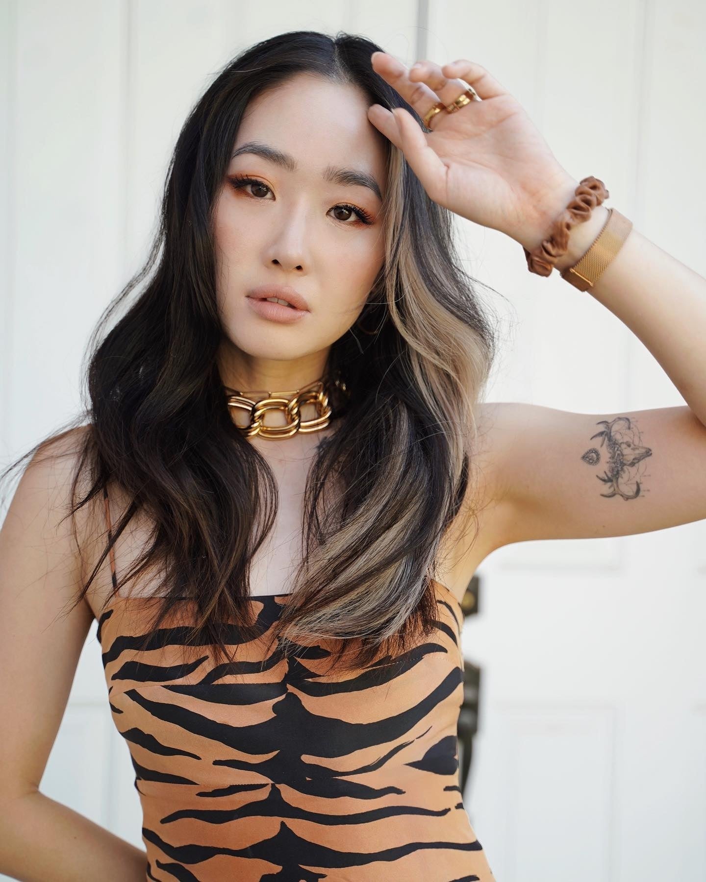 large gold chain necklace on model