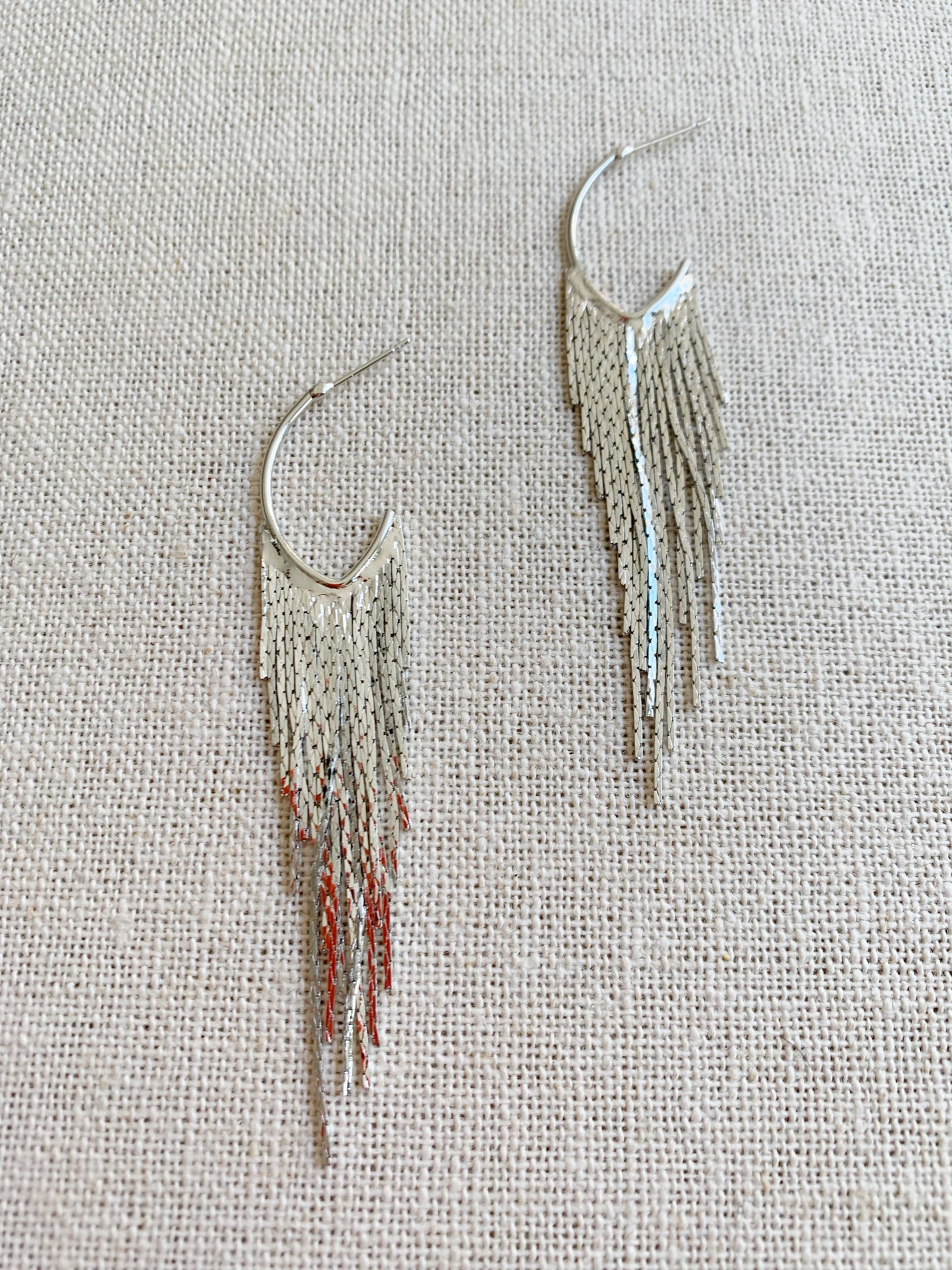 silver fringe earrings closeup