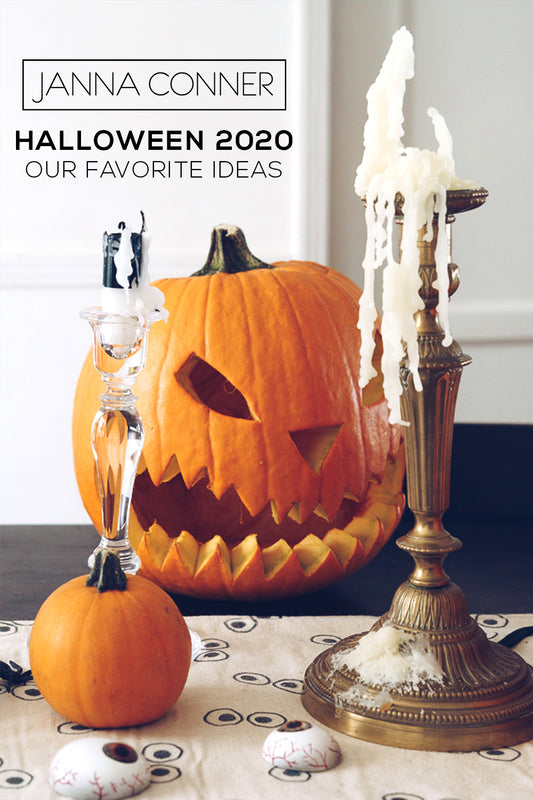 carved orange pumpkin with bronze and crystal candelabra with candle wax drippings