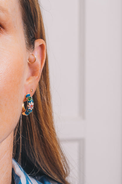 blue cloisonné enamel huggie hoops on model closeup