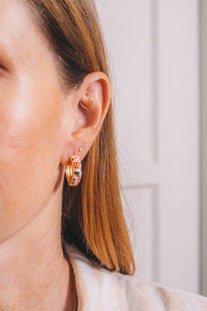 gold cloisonné huggie hoops on model