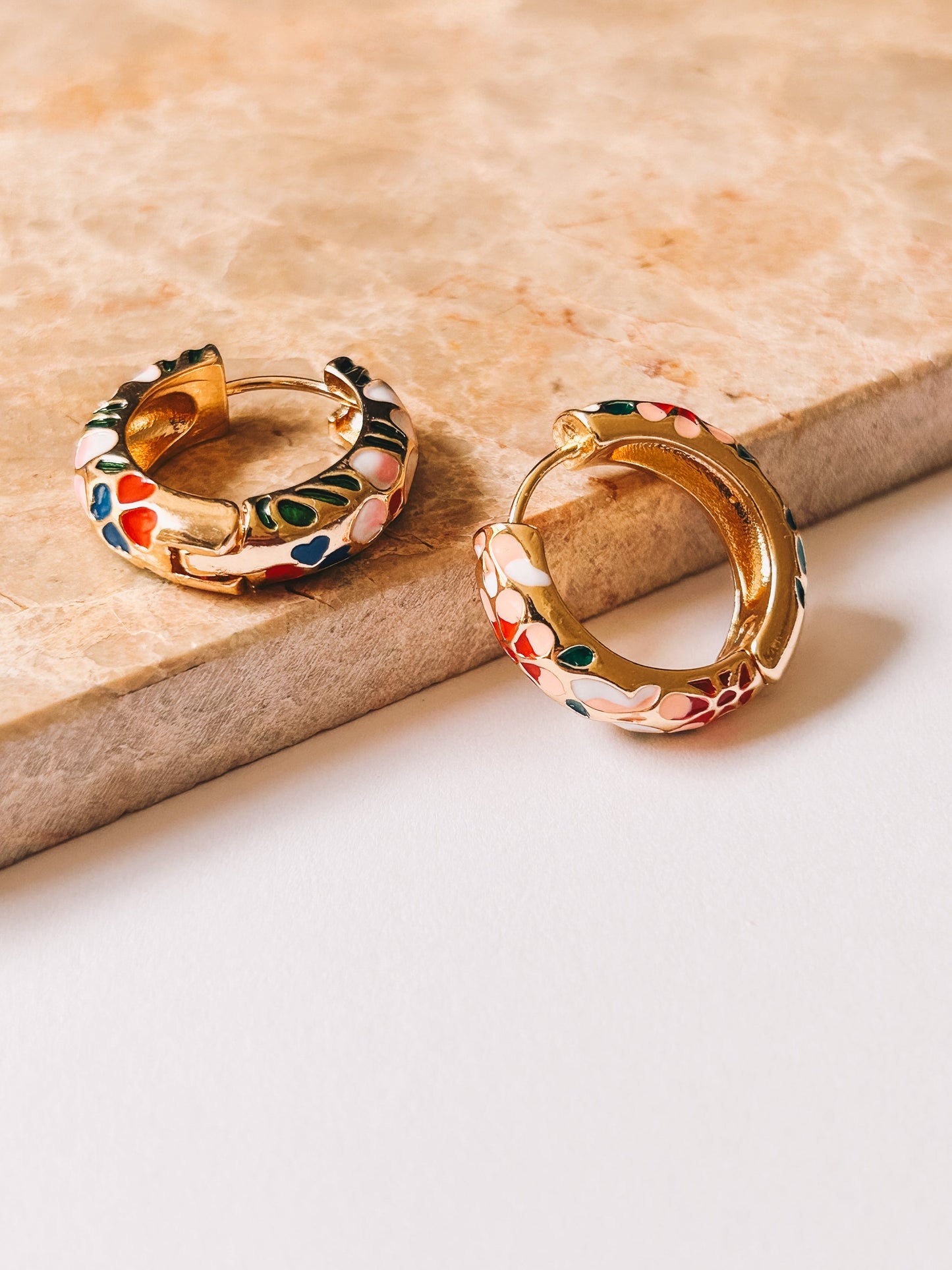 gold cloisonné huggie hoop earrings closeup