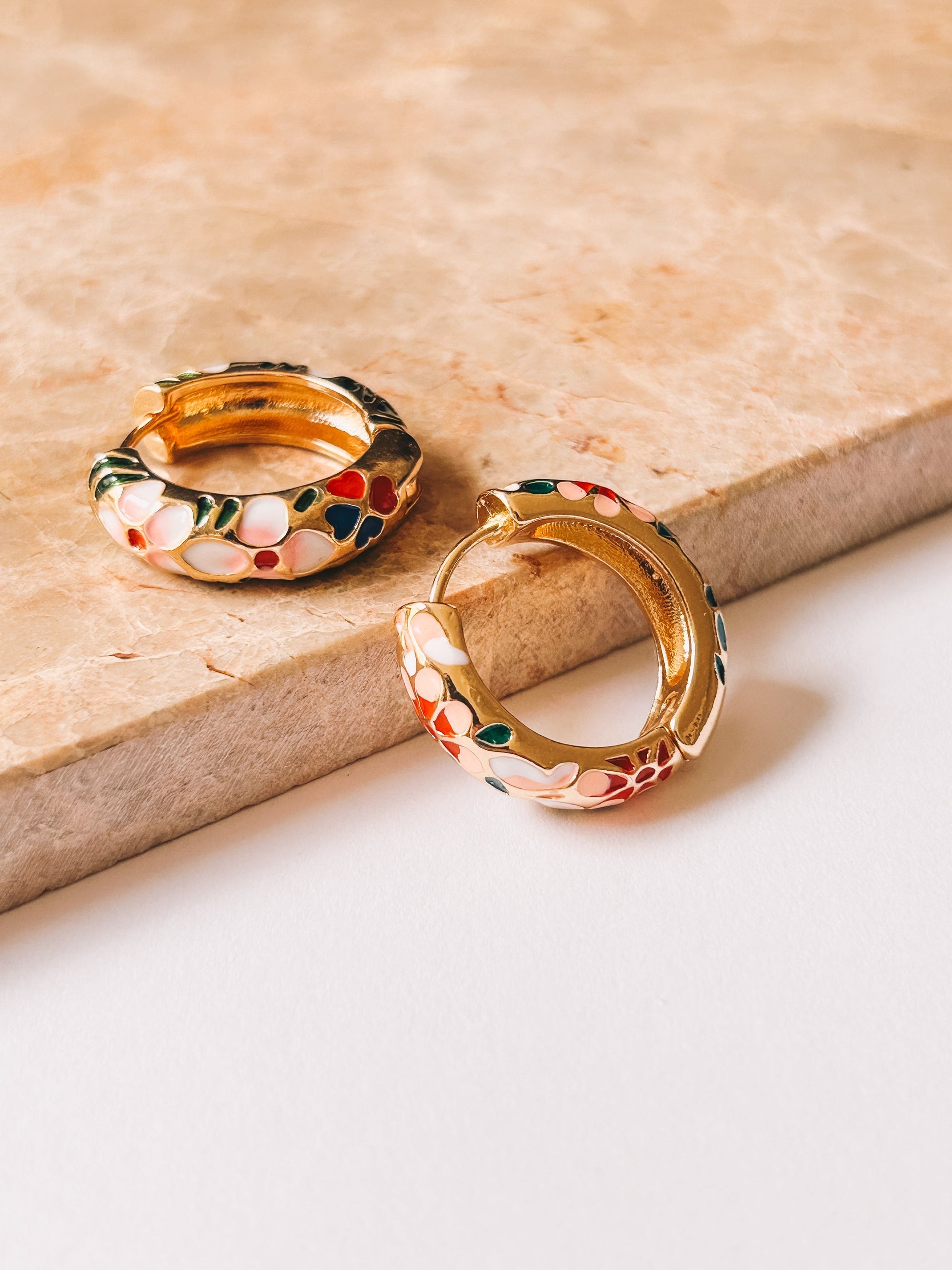 gold cloisonné hoops with flower pattern