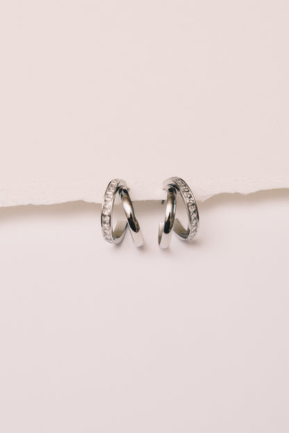 split hoop crystal earrings on white background
