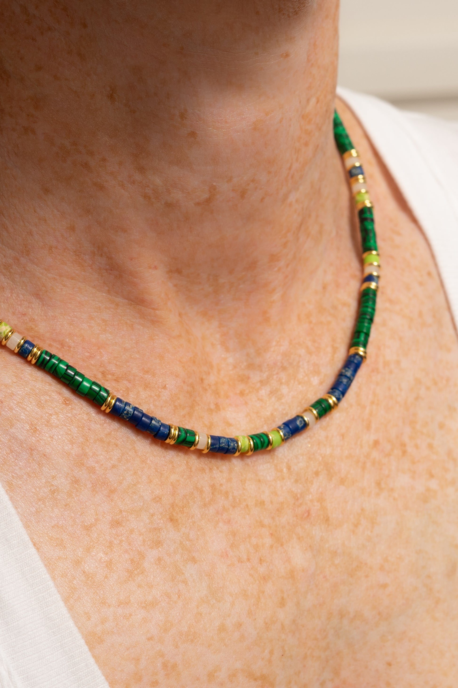 green and blue beaded rondelle necklace on model