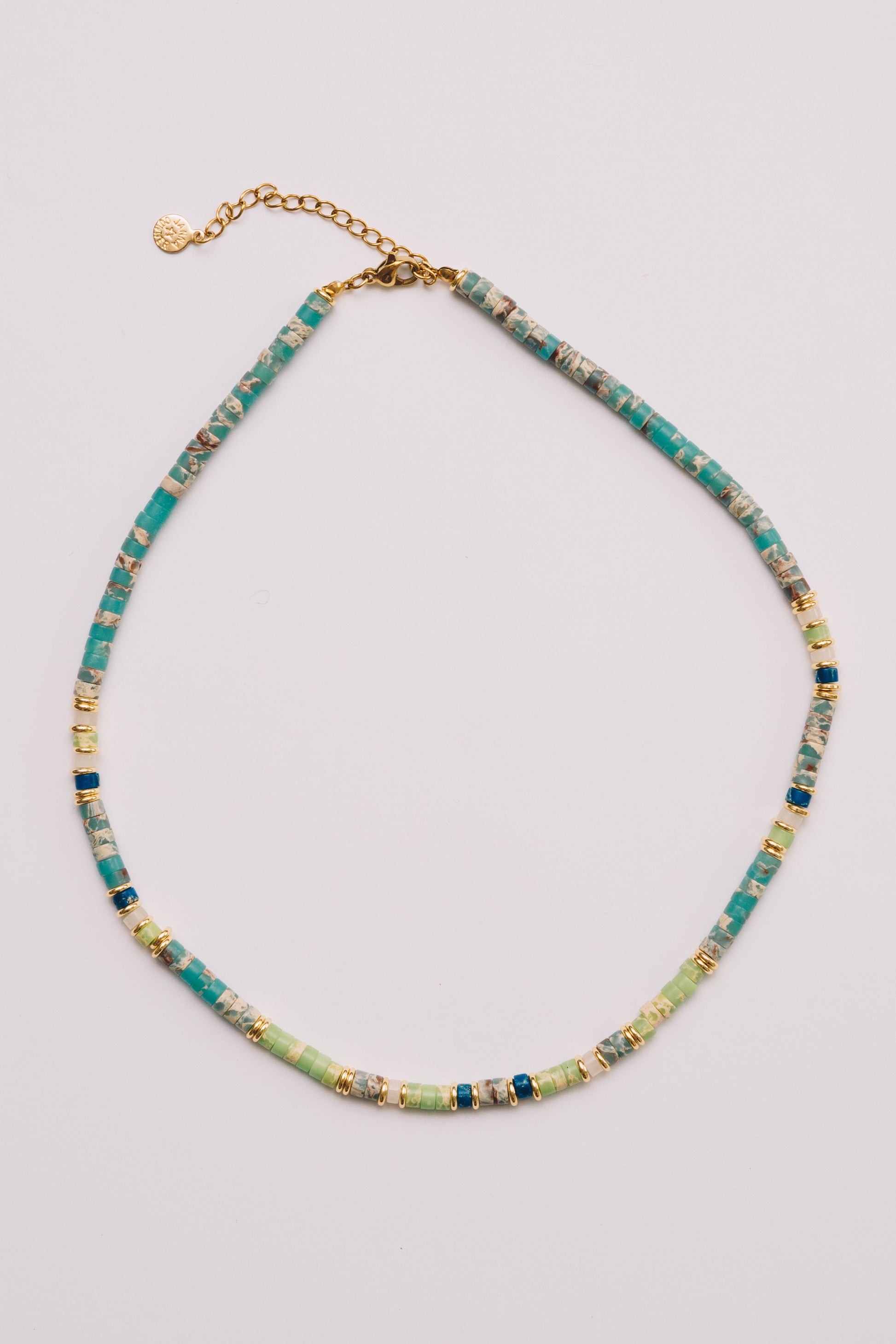 turquoise and green summer beaded necklace on white background