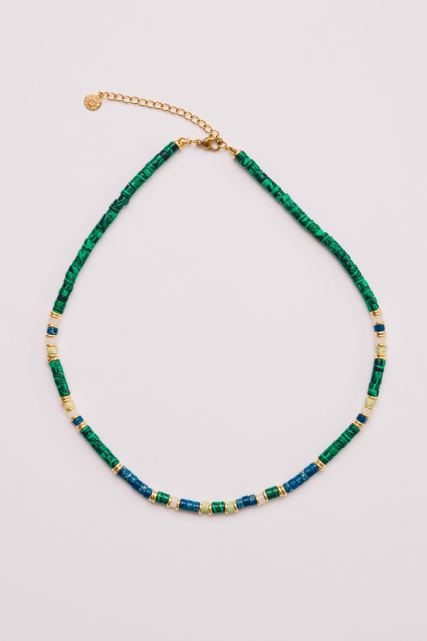 beaded green and blue rondelle necklace on white background