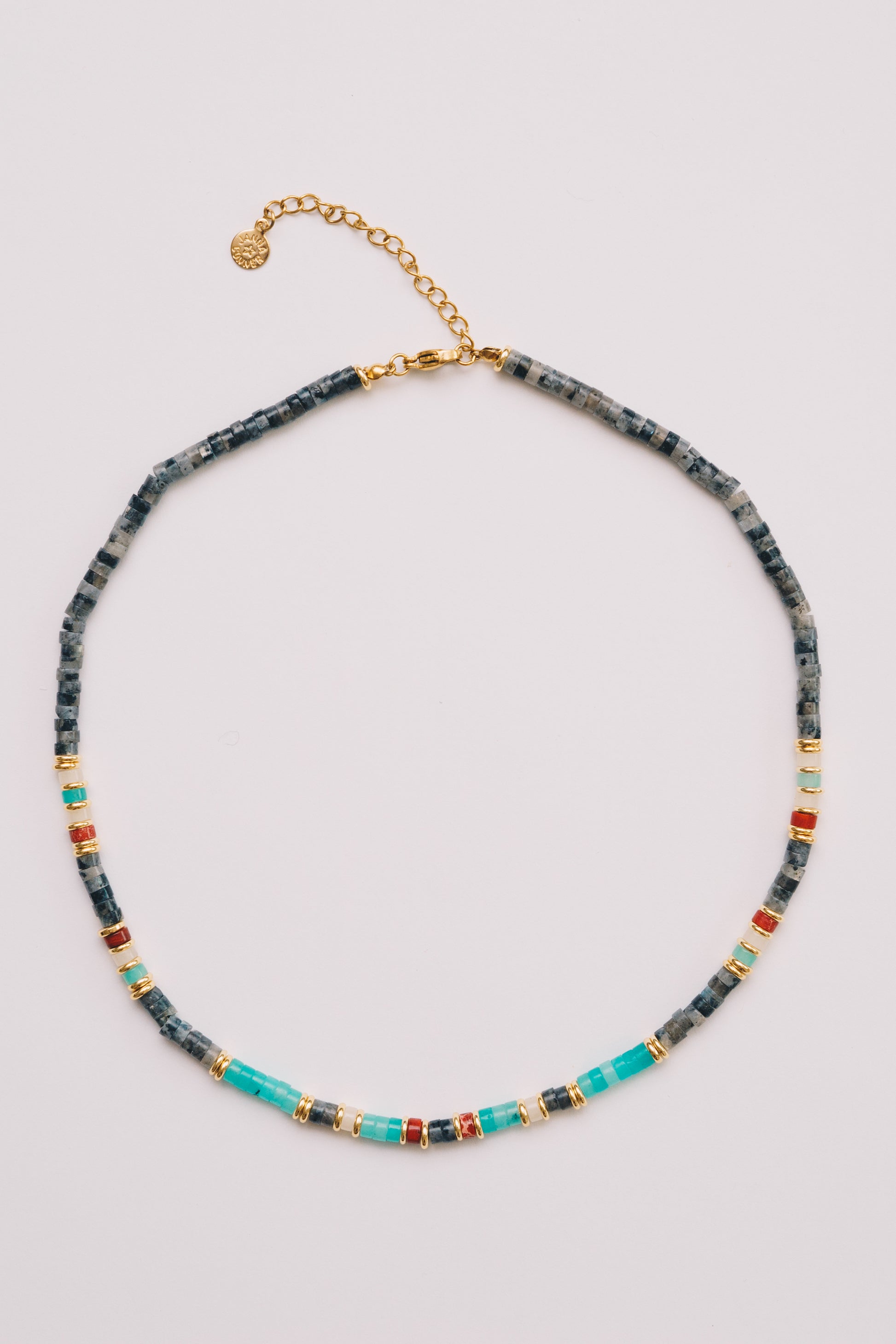 grey and turquoise beaded rondelle necklace on white background