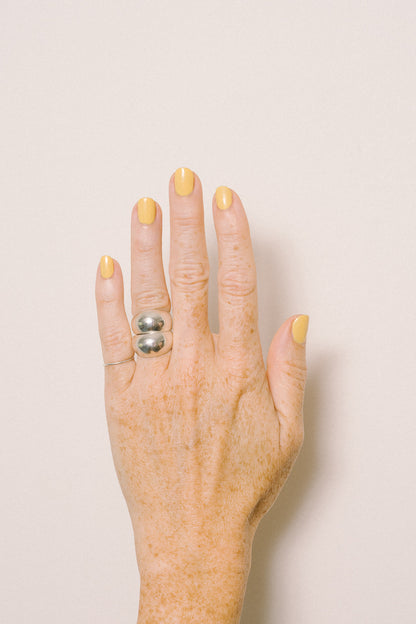 stacked silver dome rings on model hand