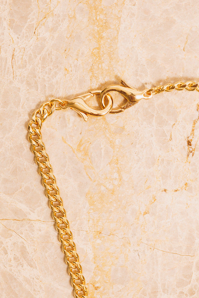 gold curb chain lobster clasp detail