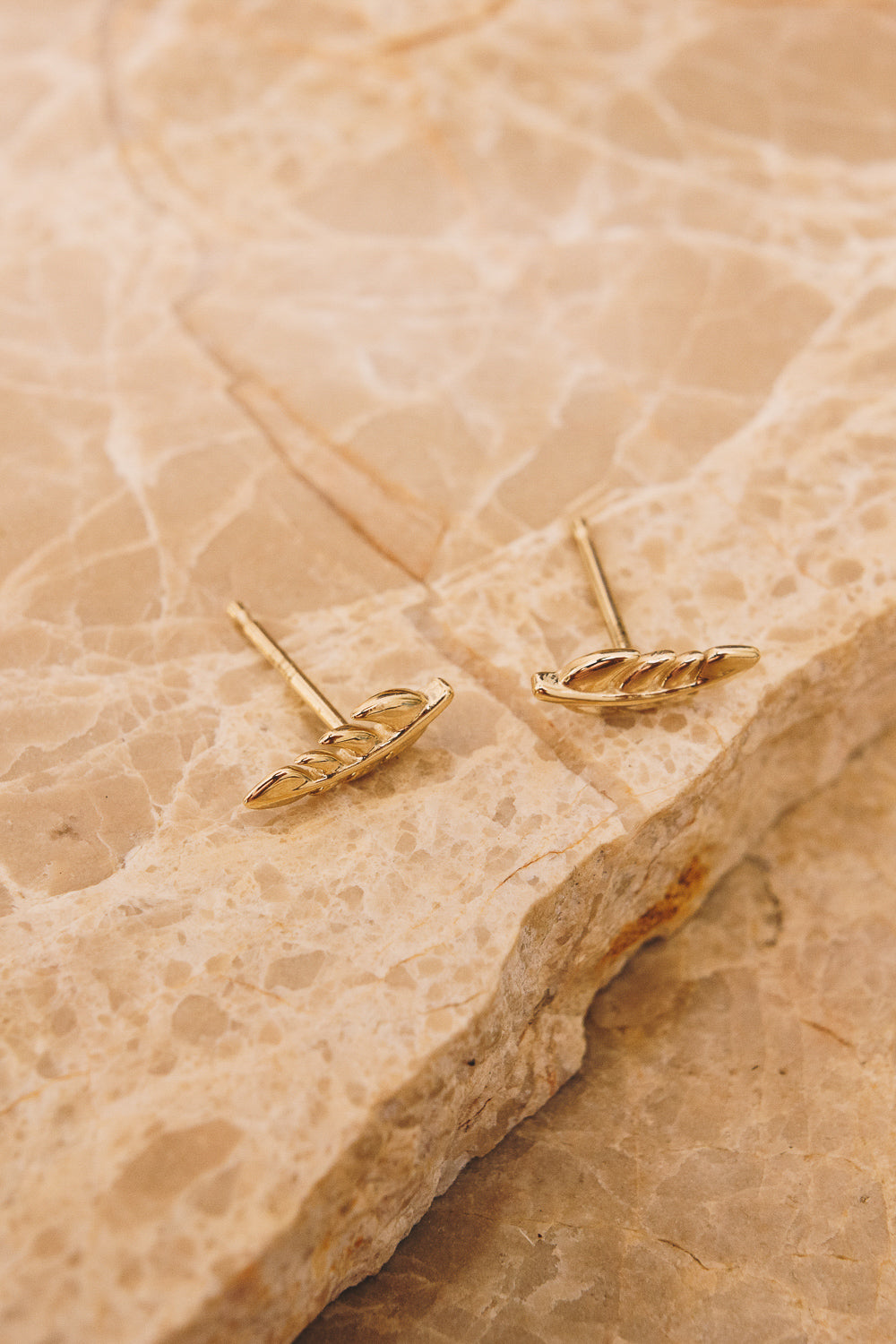 14k gold leaf earrings above view