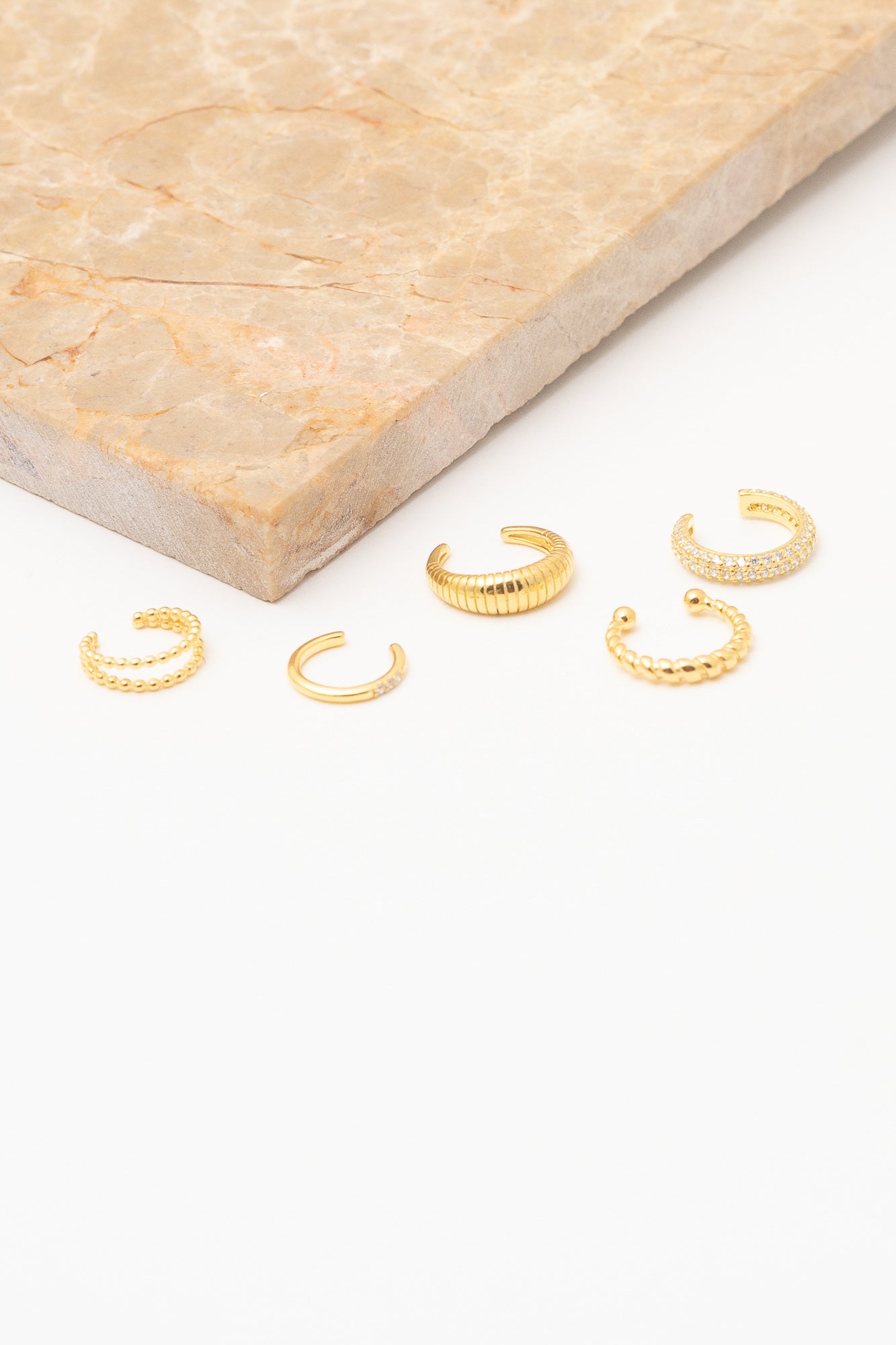 assorted gold ear cuff earrings