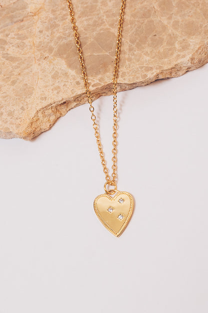 gold heart charm necklace on cable chain