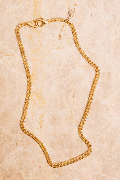 gold curb chain necklace above view