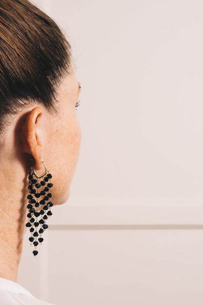black waterfall earrings on model closeup