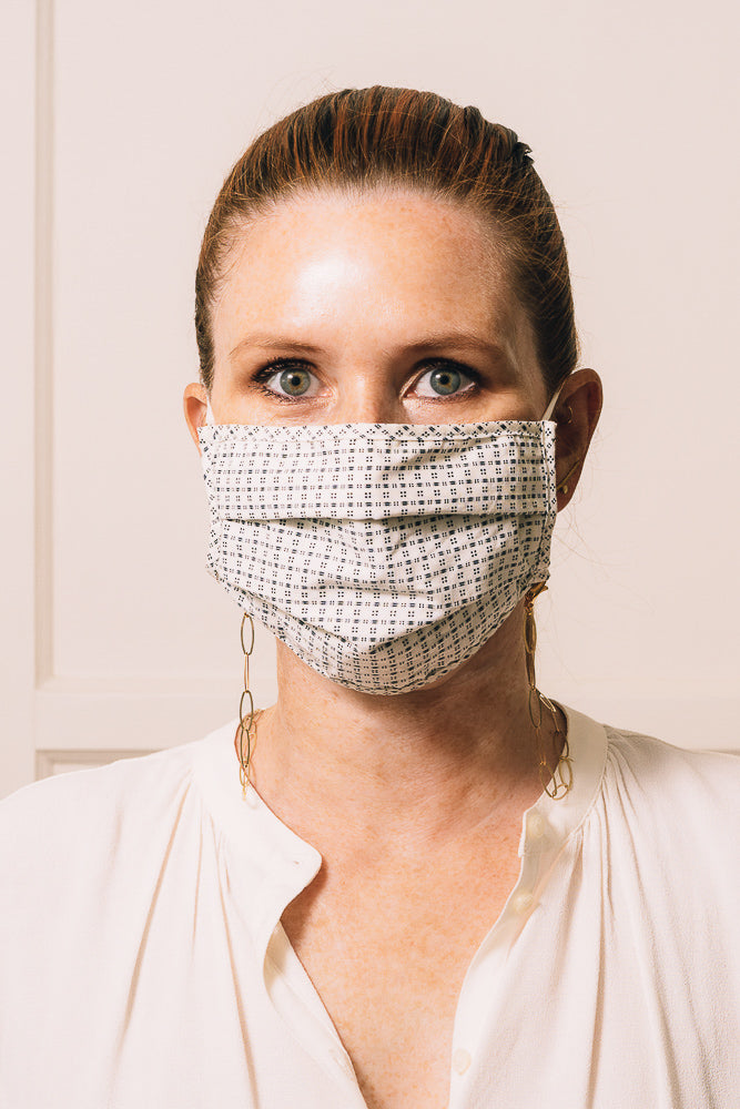 gold chain mask holder on model