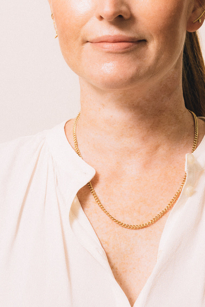 gold chain necklace on model