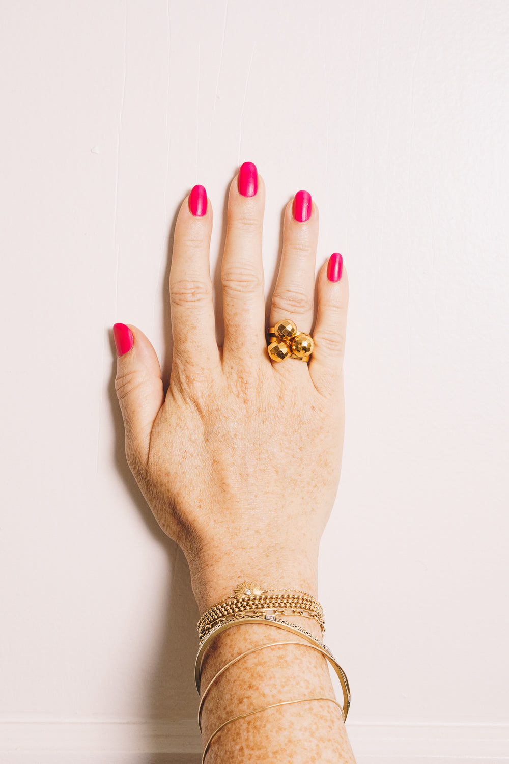 gold ball stacking ring on model hand