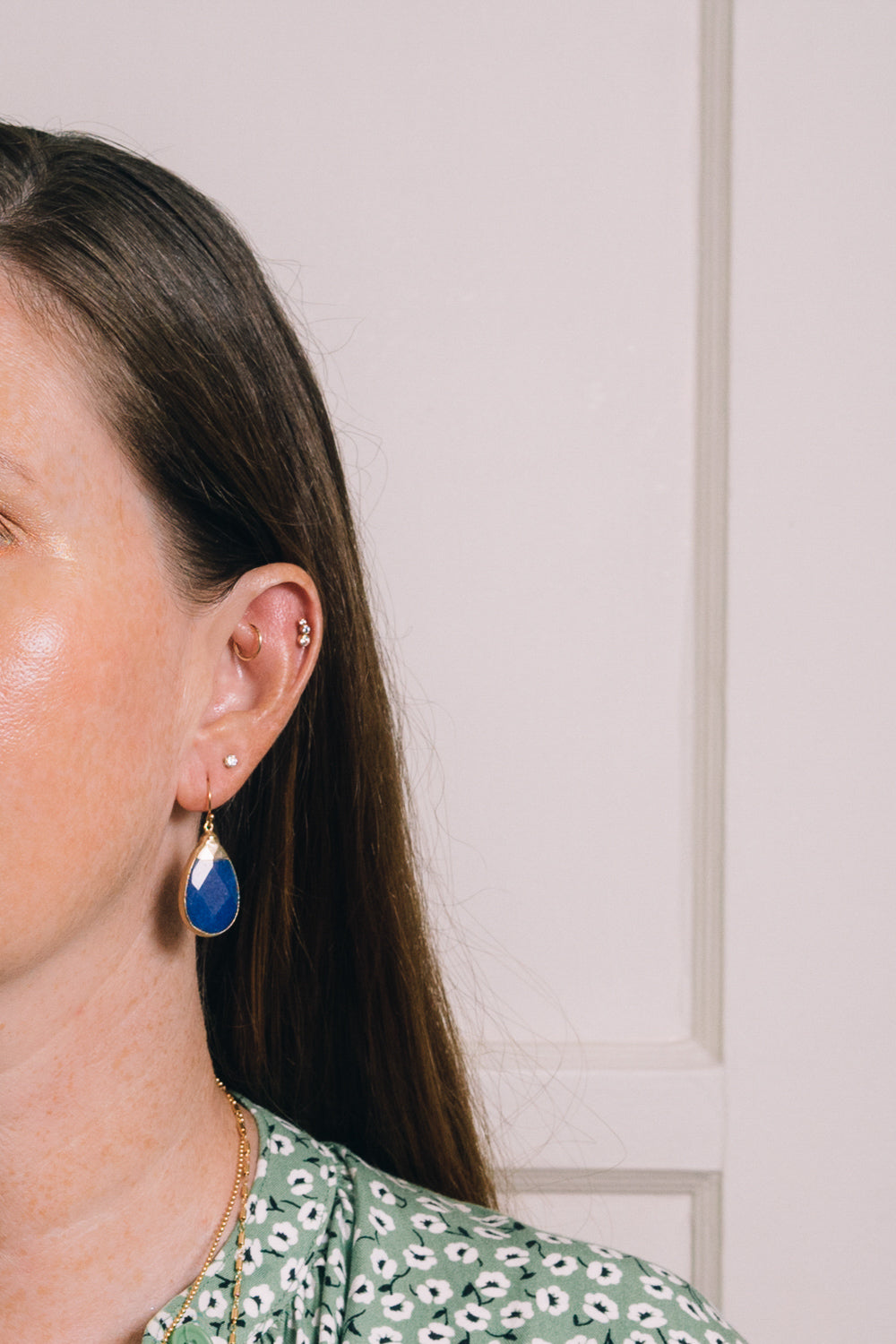 blue jade teardrop earrings on model