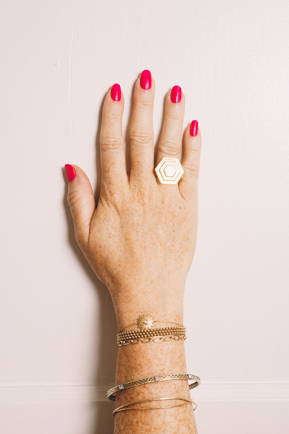 Art Deco gold hexagon ring on hand