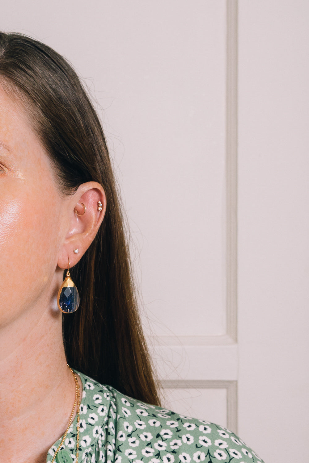 navy blue sunstone quartz teardrop earrings on model