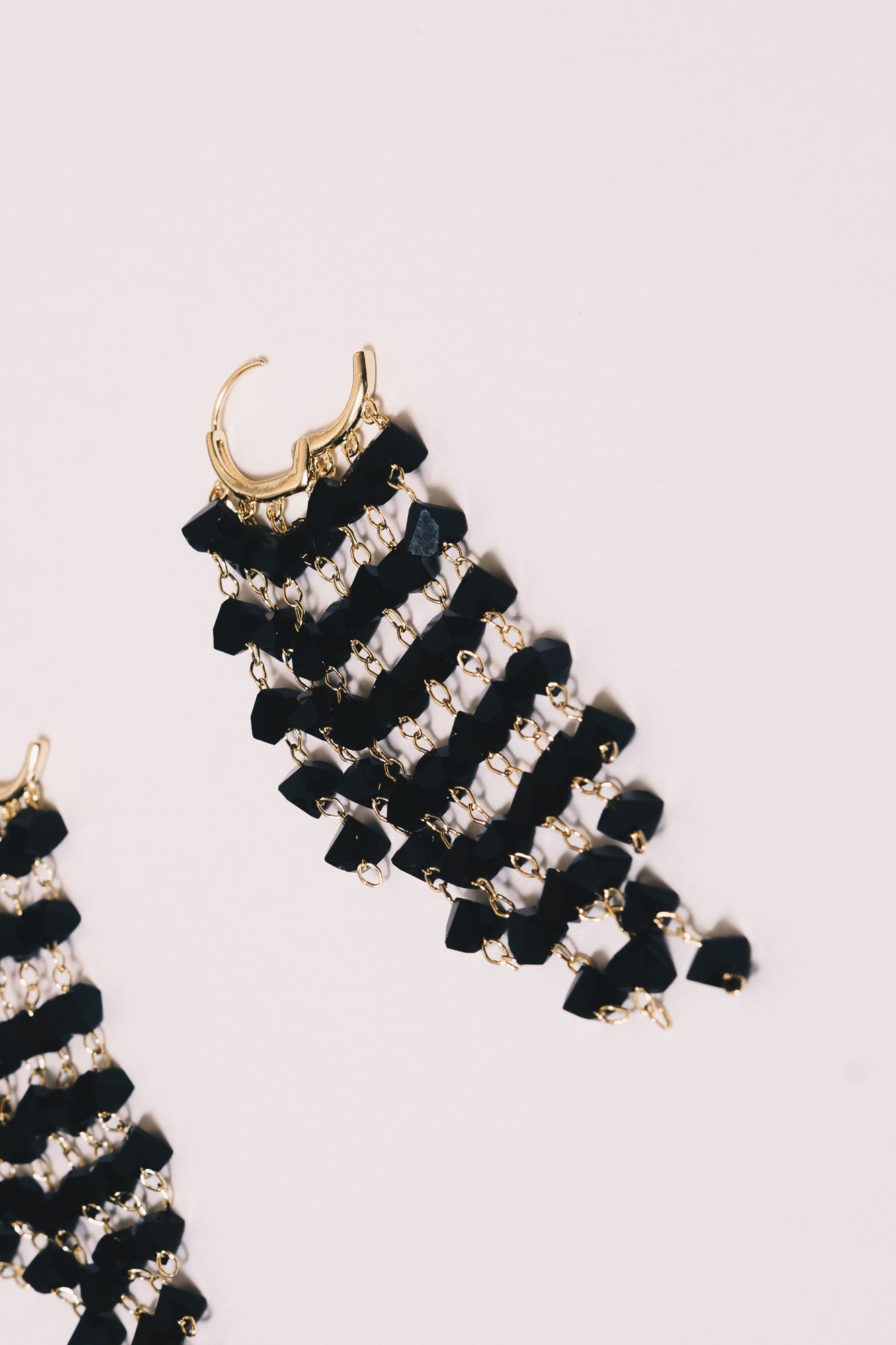 black chandelier earrings closeup