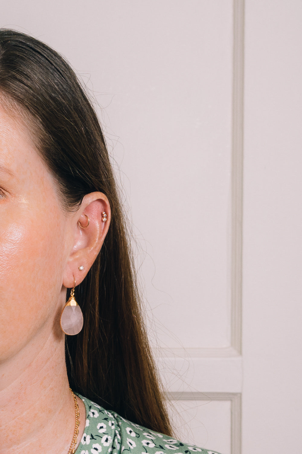 rose quartz teardrop earrings on model