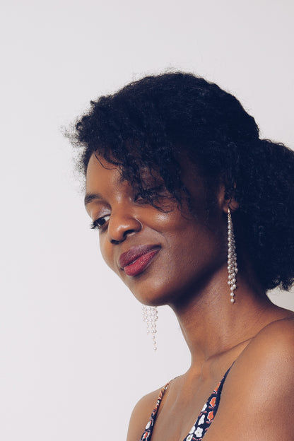 pearl fringe hoop earrings on model closeup