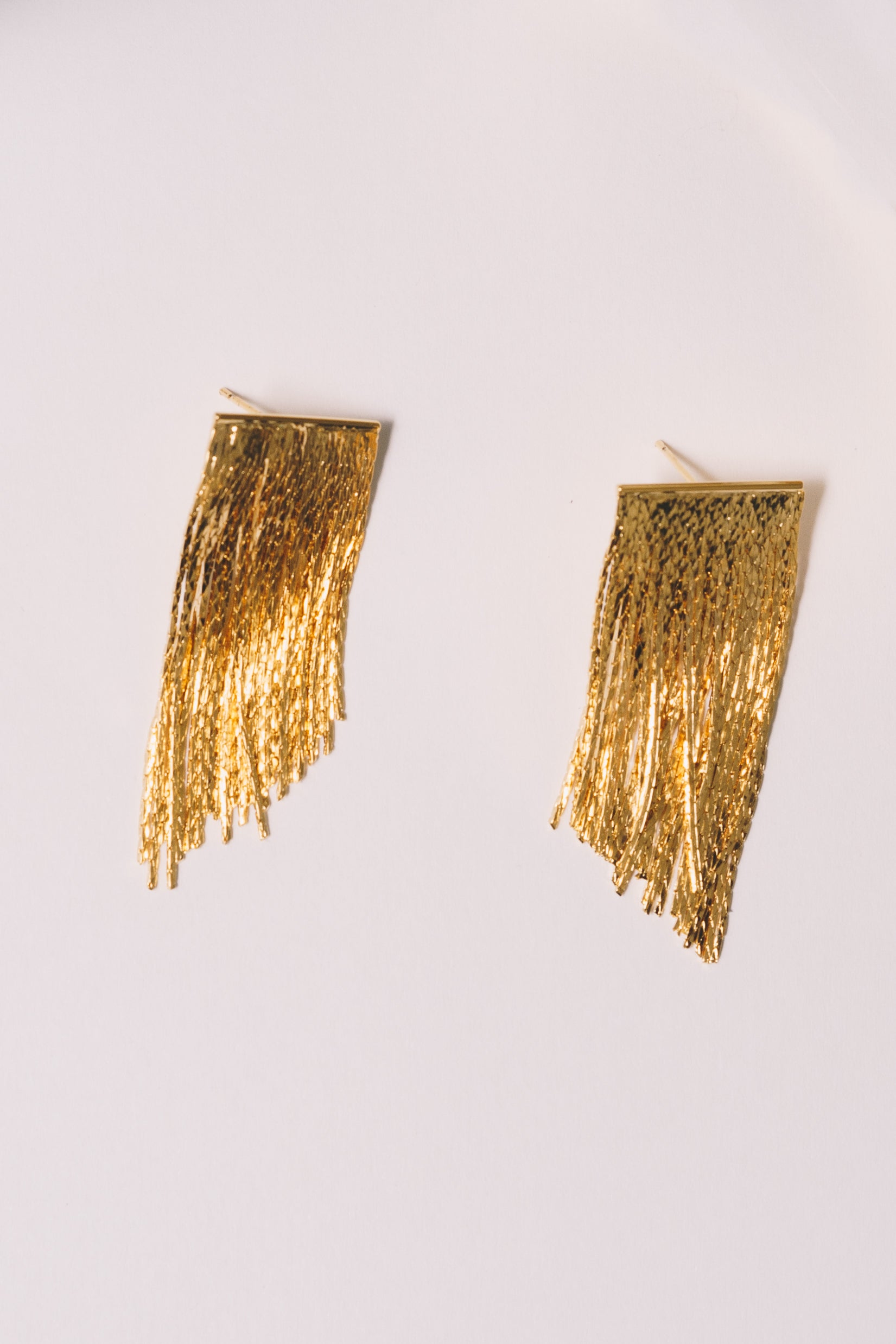 gold fringe stud earrings showing post backings