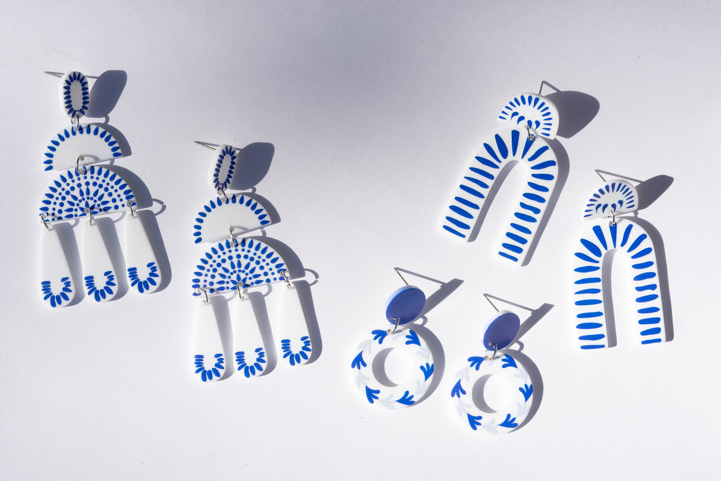 blue and white statement earrings