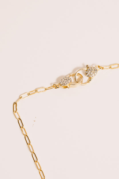 gold link chain necklace crystal clasp closeup