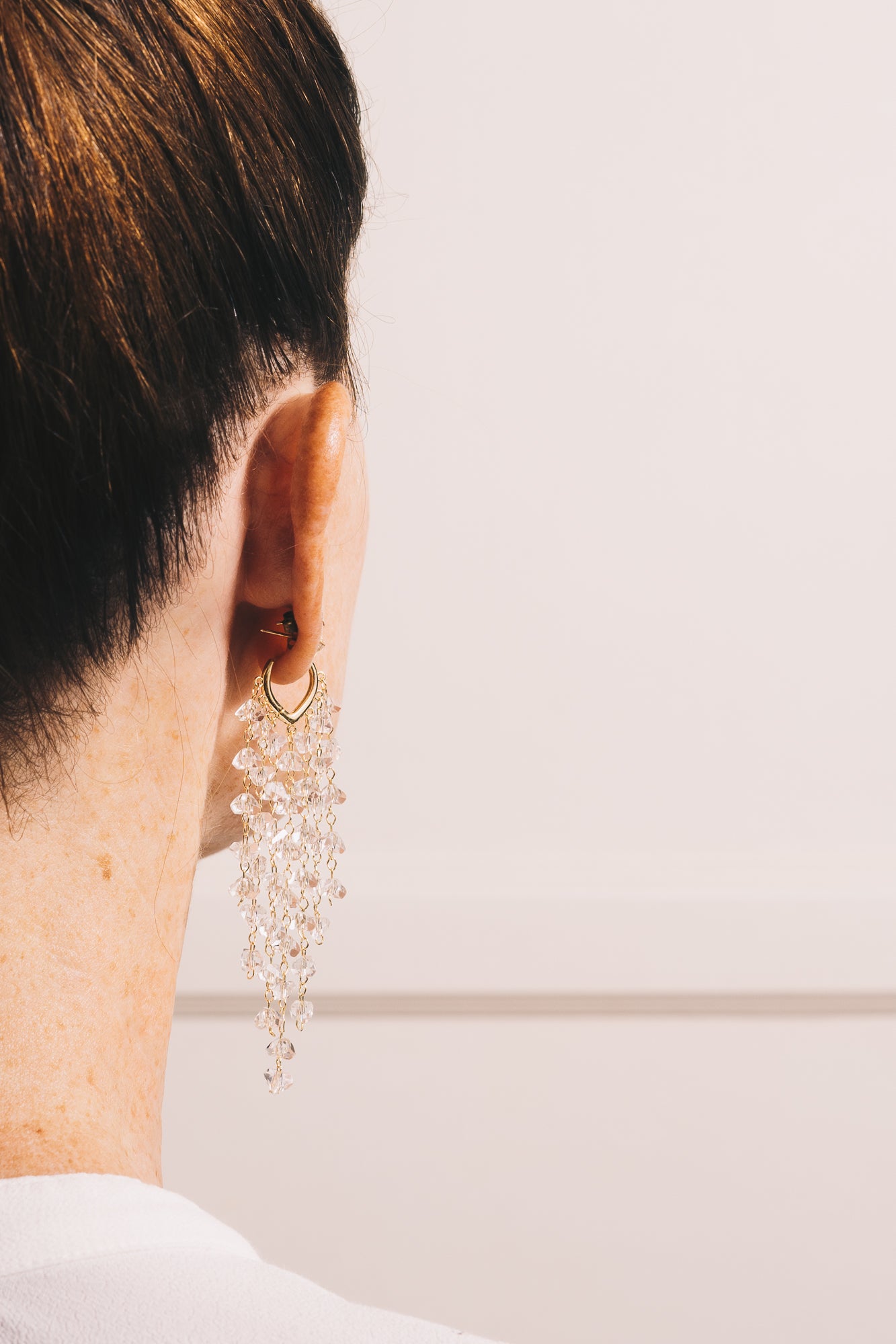 crystal waterfall earrings on model back view closeup