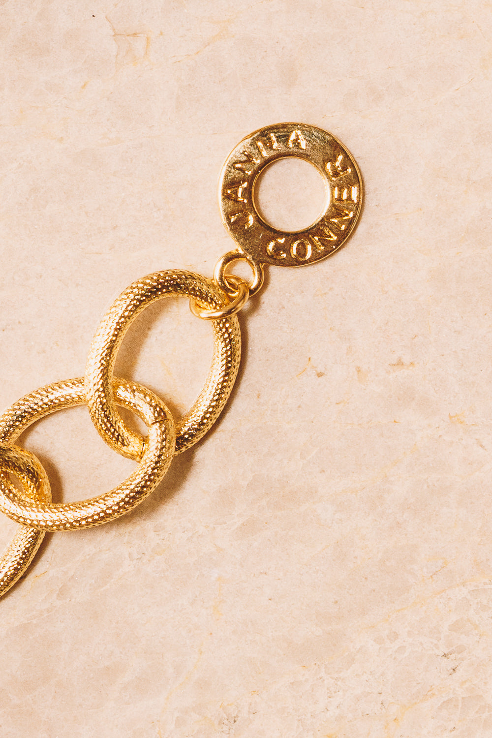 Janna Conner gold clasp closeup