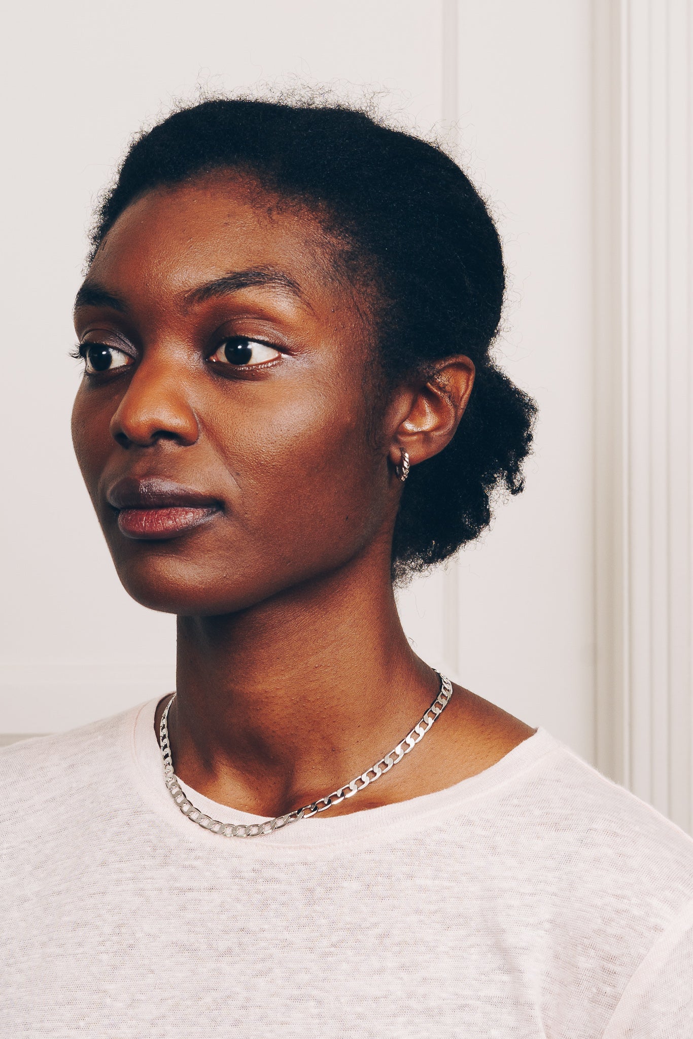 silver rope hoop earrings and chain on model