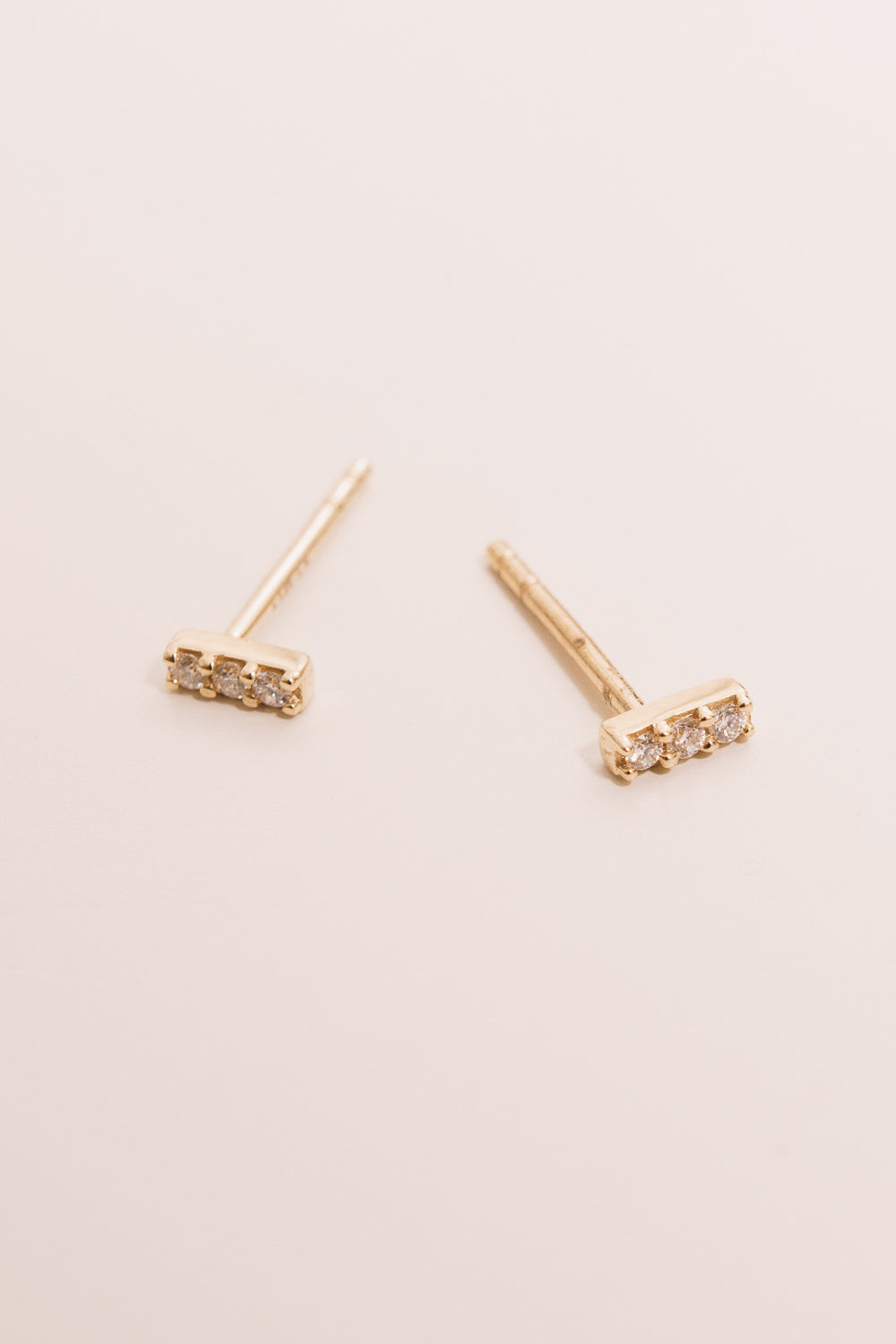 14k gold diamond bar earrings side view